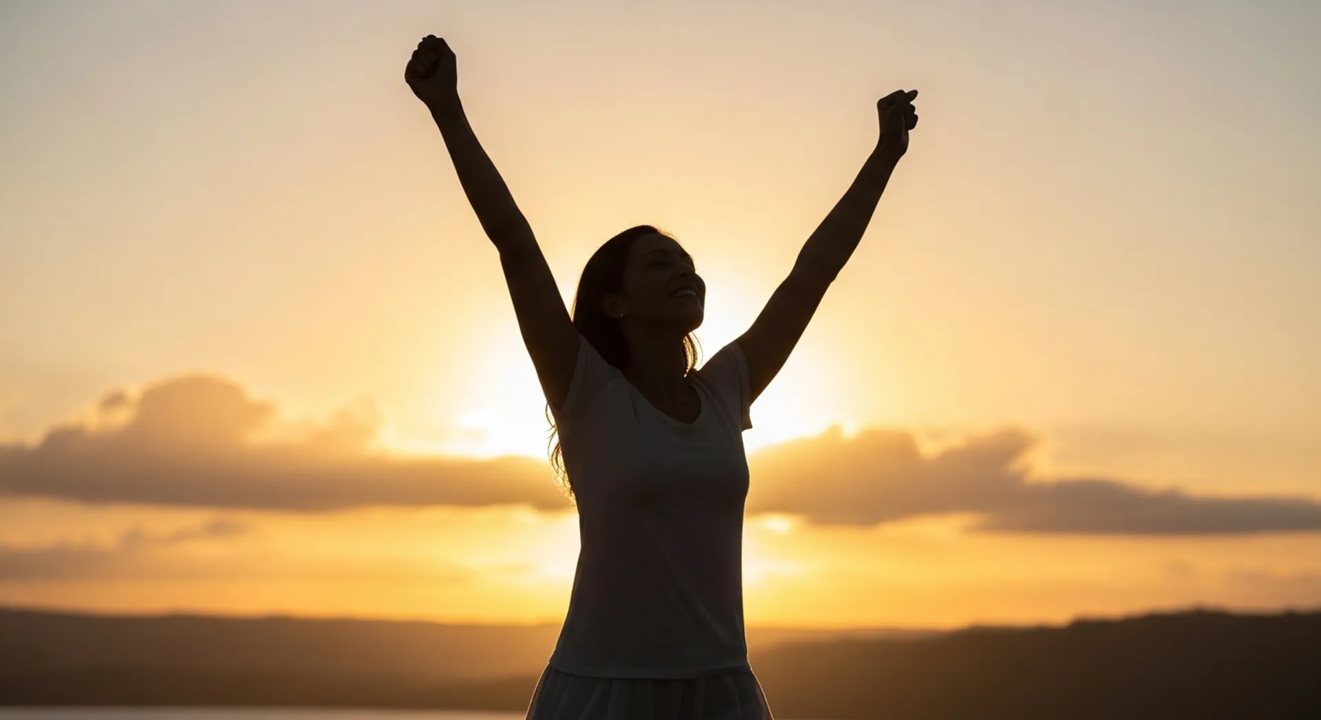 Empowered mother celebrating with arms raised - momspiration and motivation in motherhood